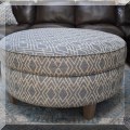 F02. Round upholstered ottoman. 21"h x 40"w 